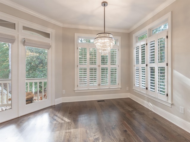 unfurnished dining area with ornamental molding, plenty of natural light, and dark wood-type flooring