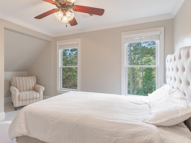 bedroom featuring ornamental molding, ceiling fan, and carpet