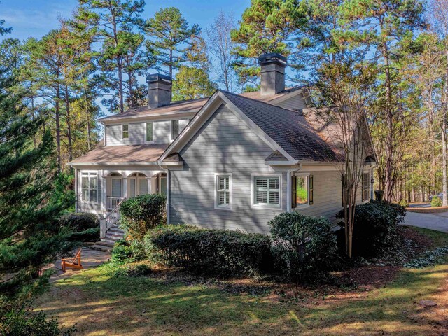 view of property exterior with a yard