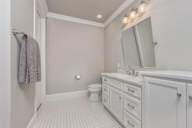 bathroom featuring vanity, ornamental molding, and toilet