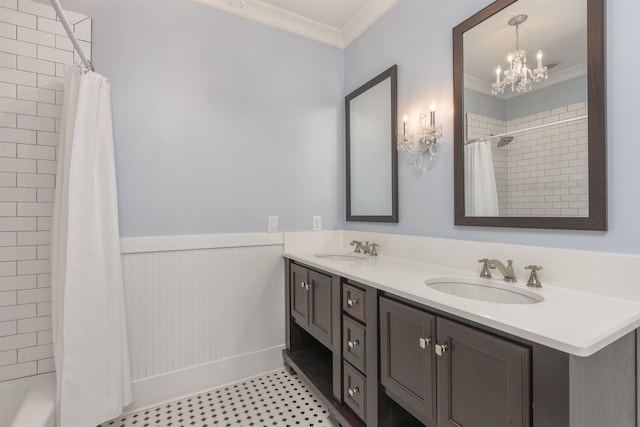 bathroom featuring vanity, a notable chandelier, ornamental molding, and shower / tub combo with curtain