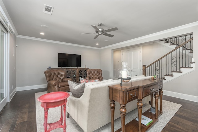 living room with ceiling fan, ornamental molding, and dark hardwood / wood-style floors