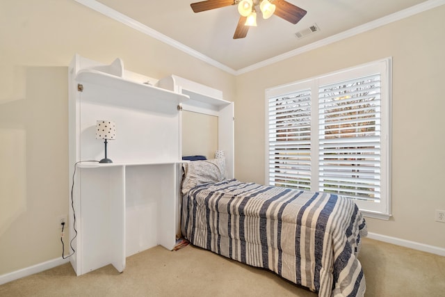 bedroom with ceiling fan, ornamental molding, and light carpet