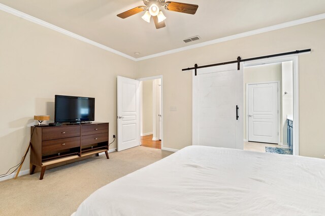 bedroom featuring crown molding, a barn door, light colored carpet, and ceiling fan