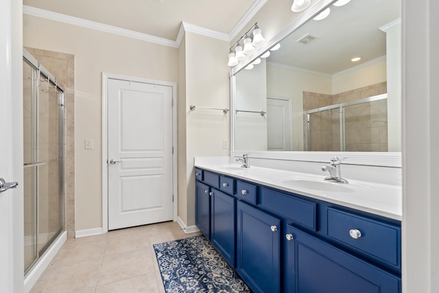 bathroom featuring ornamental molding, a shower with door, tile patterned flooring, and vanity