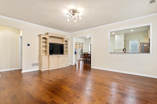 unfurnished living room with dark hardwood / wood-style flooring and ornamental molding