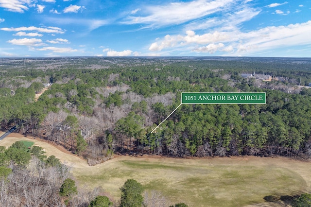 birds eye view of property with a wooded view