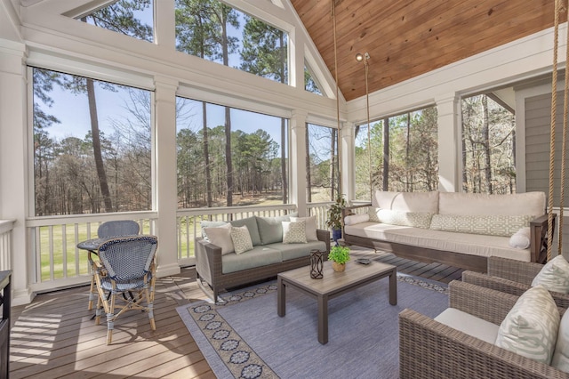 sunroom / solarium featuring lofted ceiling and wooden ceiling