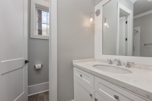 bathroom featuring vanity and wood finished floors