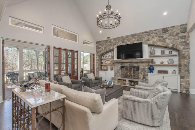 living room featuring dark wood-style floors, a fireplace, high vaulted ceiling, recessed lighting, and a chandelier