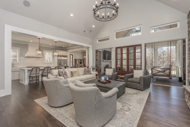 living area with high vaulted ceiling, dark wood-type flooring, and ornamental molding