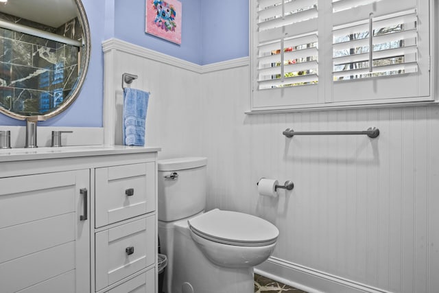 full bathroom featuring toilet and vanity