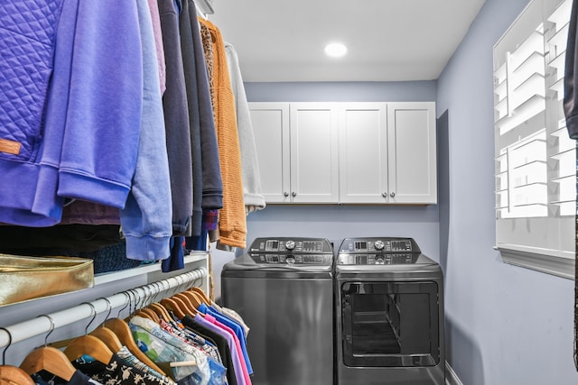 clothes washing area with cabinet space, recessed lighting, washer and dryer, and baseboards