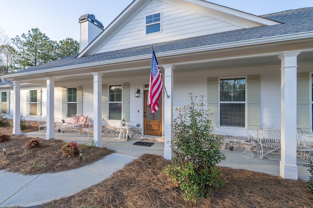 5761 Dixie Hwy, Rutledge, GA 30663 - entrance to property featuring a porch, a shingled roof, and a chimney