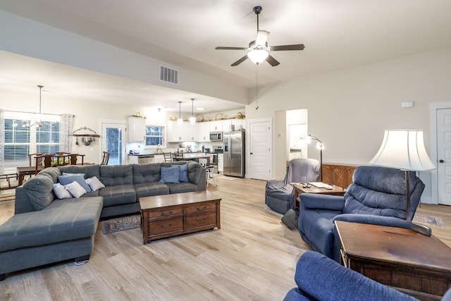 5761 Dixie Hwy, Rutledge, GA 30663 - living room with a chandelier, a ceiling fan, and light wood-type flooring