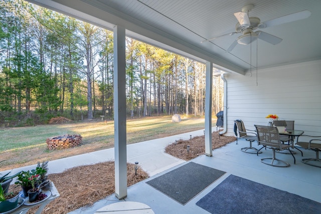 5761 Dixie Hwy, Rutledge, GA 30663 - view of patio featuring a ceiling fan, a fire pit, and outdoor dining area