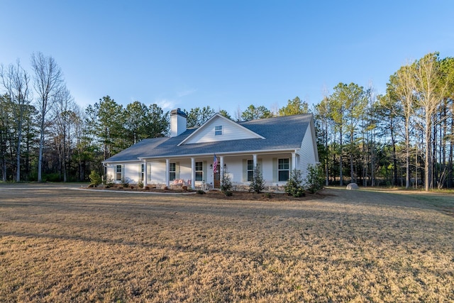 5761 Dixie Hwy, Rutledge, GA 30663 - farmhouse inspired home featuring covered porch, a chimney, and a front yard