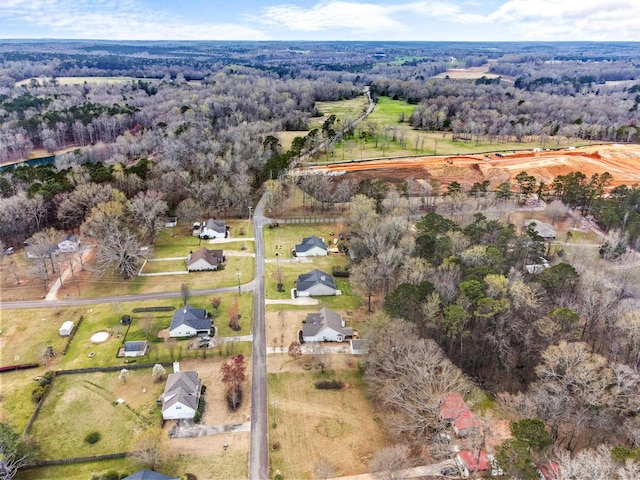 bird's eye view featuring a forest view