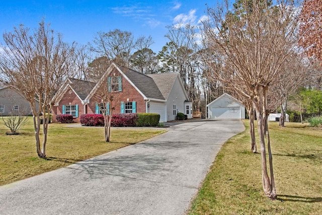 traditional home with a garage, brick siding, an outdoor structure, and a front lawn