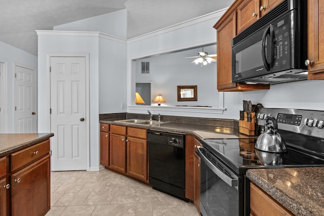 kitchen with visible vents, ceiling fan, brown cabinets, black appliances, and a sink