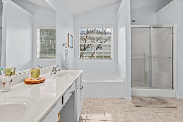 full bath featuring vaulted ceiling, double vanity, a stall shower, and a sink