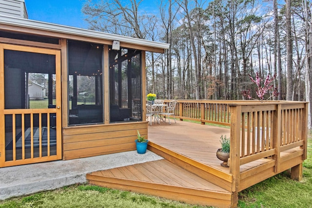 wooden deck featuring a sunroom