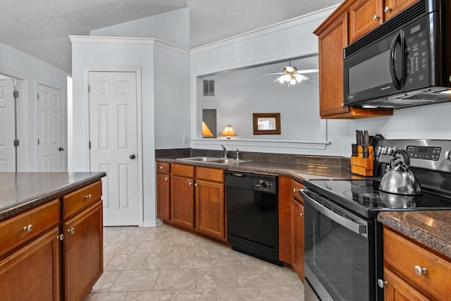 kitchen with brown cabinetry, a ceiling fan, visible vents, a sink, and black appliances