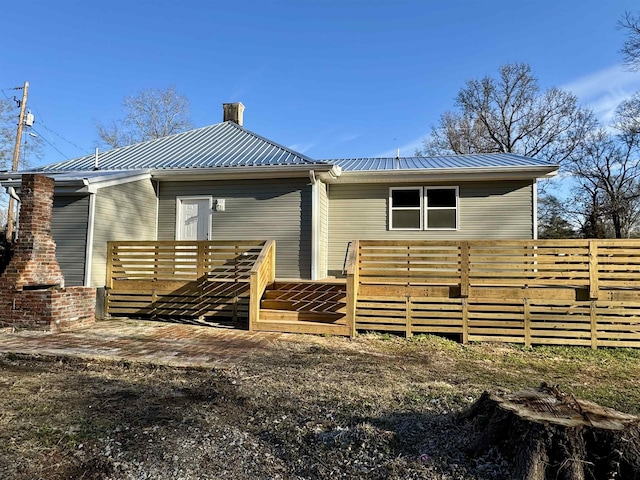 back of property featuring a deck