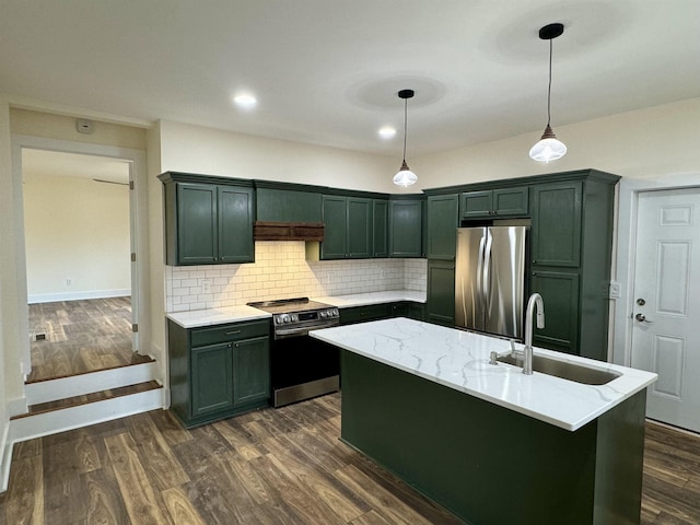 kitchen featuring appliances with stainless steel finishes, pendant lighting, sink, light stone counters, and dark wood-type flooring