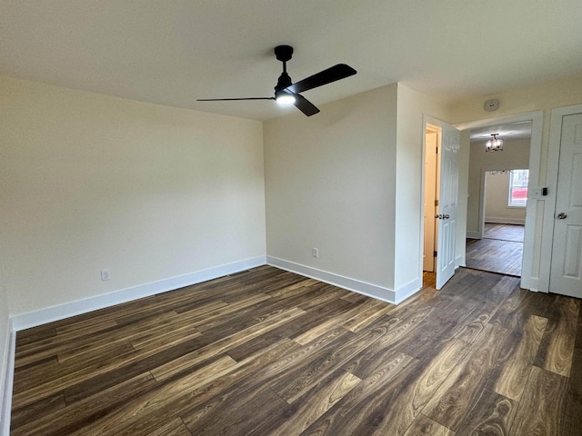 unfurnished room featuring dark hardwood / wood-style flooring and ceiling fan