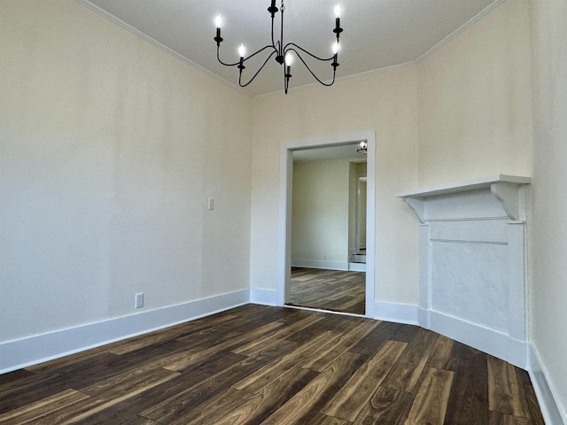 unfurnished dining area featuring ornamental molding, dark hardwood / wood-style flooring, and a chandelier