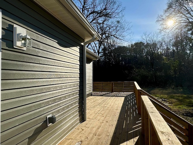 view of side of property featuring a deck