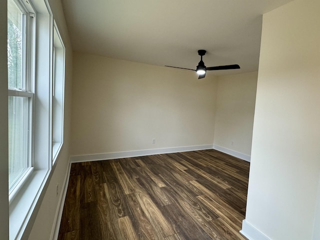 unfurnished room featuring ceiling fan and dark hardwood / wood-style flooring