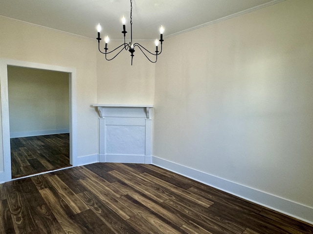 unfurnished dining area with crown molding, an inviting chandelier, and dark hardwood / wood-style flooring