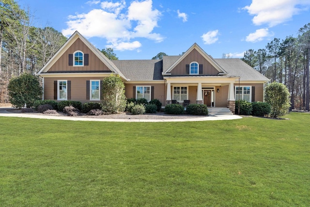 craftsman-style home with a front lawn and a porch