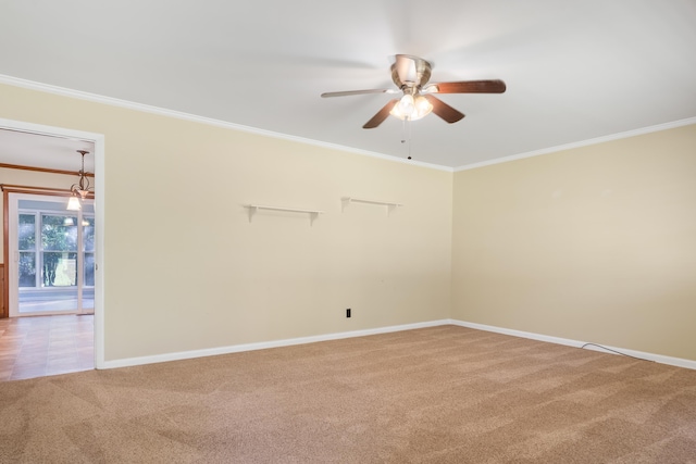 unfurnished room featuring crown molding, ceiling fan, and carpet