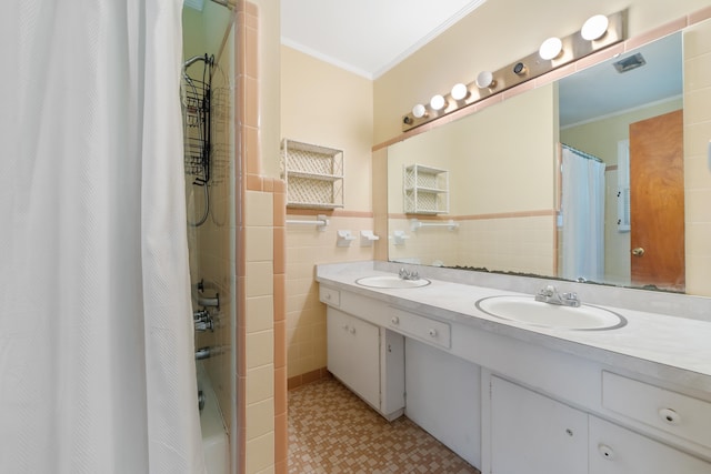 bathroom featuring ornamental molding, curtained shower, tile walls, and vanity