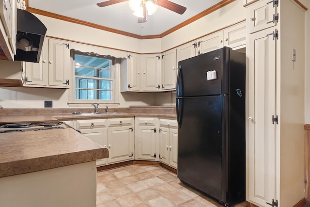 kitchen with black refrigerator, extractor fan, crown molding, and ceiling fan