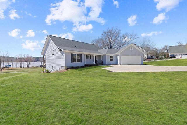 1051 Twin Rivers Rd, Greensboro, GA 30642 - view of front of home with concrete driveway, an attached garage, a front yard, and a water view
