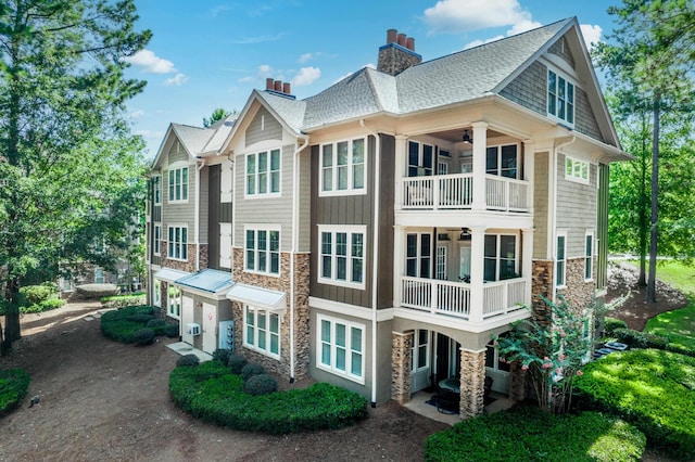 view of side of home with a balcony