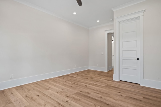 empty room featuring crown molding, ceiling fan, and light hardwood / wood-style floors