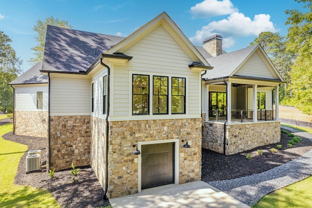 view of front of house with a garage and a porch