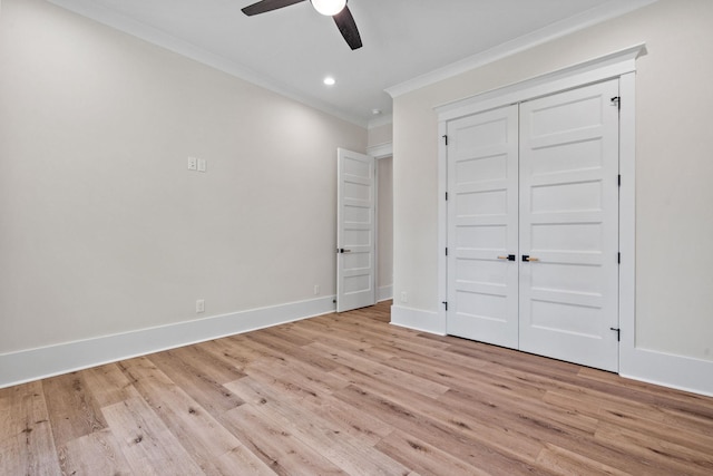 unfurnished bedroom featuring crown molding, ceiling fan, a closet, and light hardwood / wood-style flooring