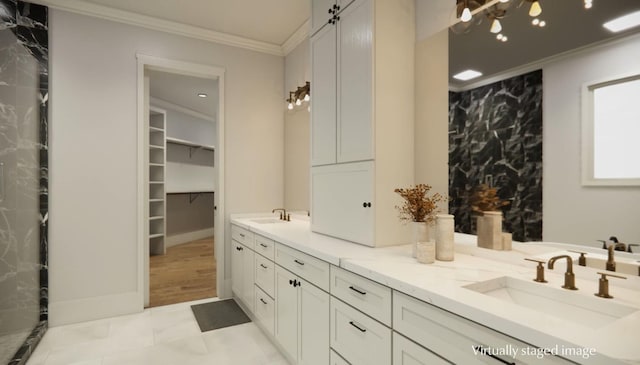 bathroom with crown molding and vanity