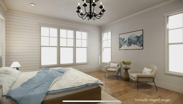 bedroom featuring multiple windows, crown molding, a chandelier, and light hardwood / wood-style flooring