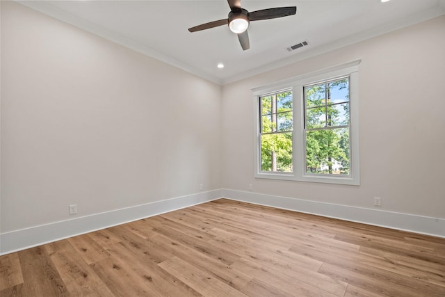 unfurnished room featuring crown molding, ceiling fan, and light wood-type flooring