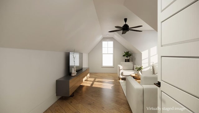 additional living space with ceiling fan, lofted ceiling, and hardwood / wood-style floors