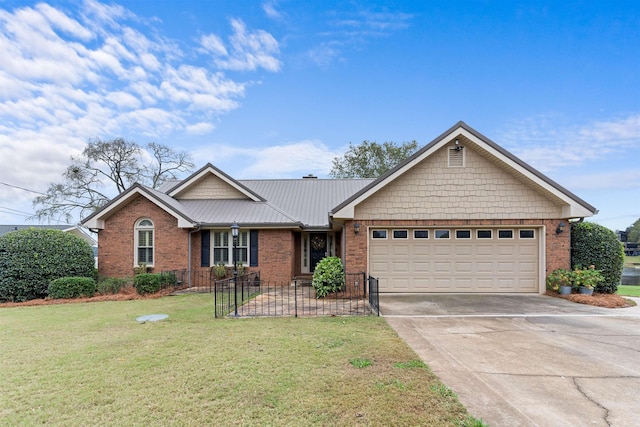 view of front facade with a garage and a front lawn