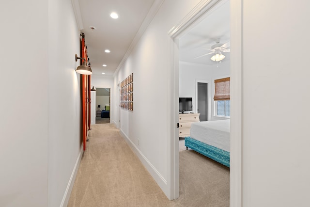 hall with baseboards, light colored carpet, recessed lighting, and ornamental molding