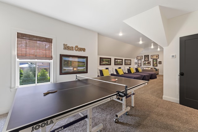 game room featuring baseboards, lofted ceiling, and carpet